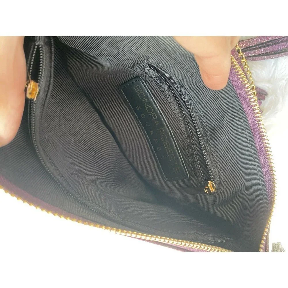 Sondra Roberts purple sparkly wristlet with gold chain details